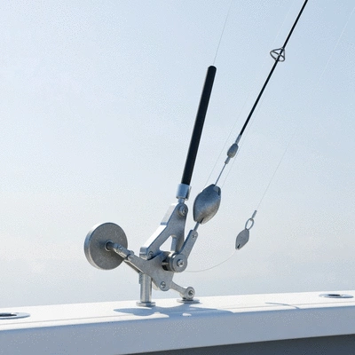 Detailed view of a downrigger setup on a fishing boat, showing the weight, line, and release mechanism, no text, no words, no typography, 8K